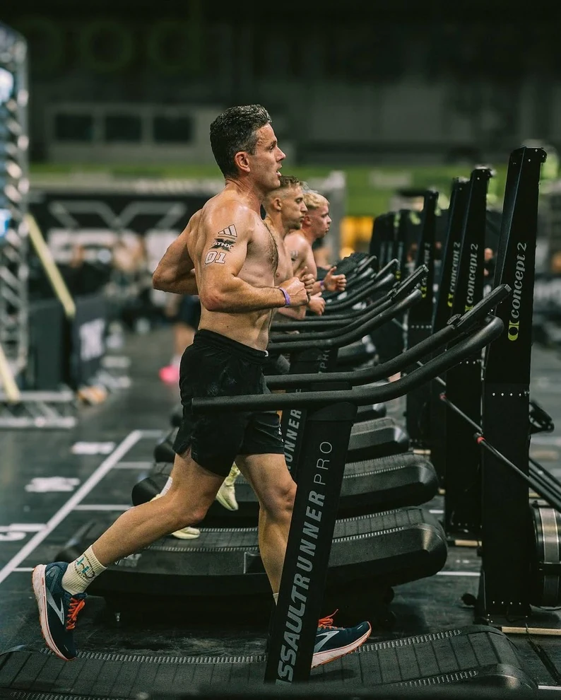 Athletes running on curved treadmills at ATHX.